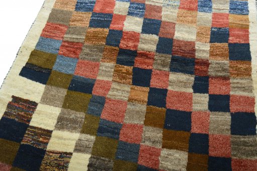 Backside of handmade 2000s Persian Gabbeh rug showing knot structure and weave density