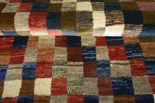 Full view of 2000s Persian Gabbeh rug from Iran / Persia, 196 × 103 cm in Multi Color tones