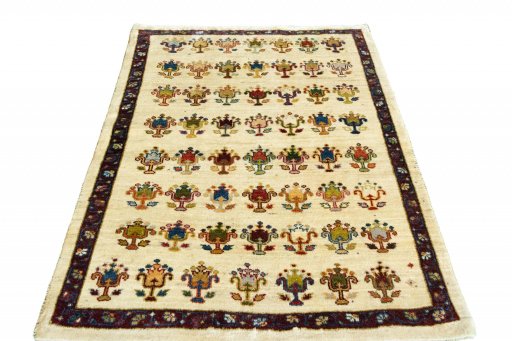 Surface texture of 2000s Persian Gabbeh rug with natural Wool and intricate pattern