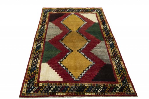 Surface texture of 2000s Persian Gabbeh rug with natural Wool and intricate pattern