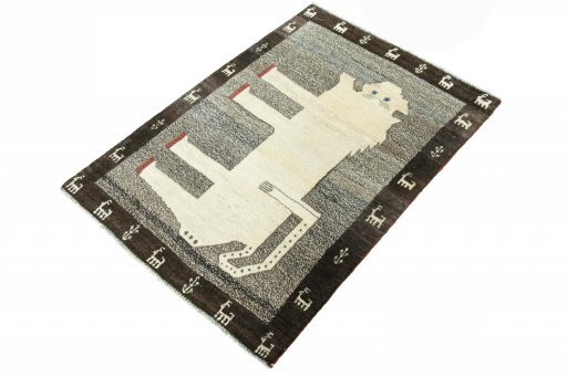 Corner detail of 2000s Persian Gabbeh rug showing border pattern and Wool pile