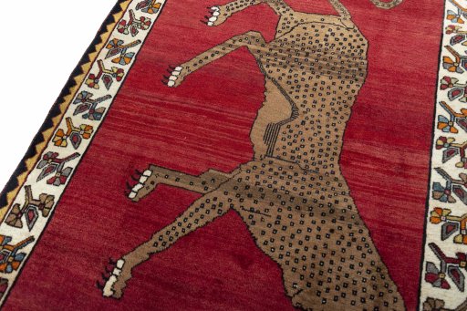 Backside of handmade 2000s Persian Gabbeh rug showing knot structure and weave density
