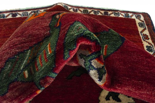 Corner detail of 2000s Persian Gabbeh rug showing border pattern and Wool pile