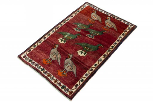 Corner detail of 2000s Persian Gabbeh rug showing border pattern and Wool pile