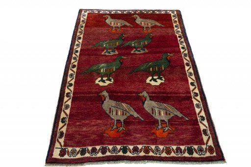 Surface texture of 2000s Persian Gabbeh rug with natural Wool and intricate pattern
