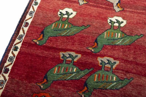 Backside of handmade 2000s Persian Gabbeh rug showing knot structure and weave density
