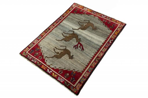 Corner detail of 2000s Persian Gabbeh rug showing border pattern and Wool pile