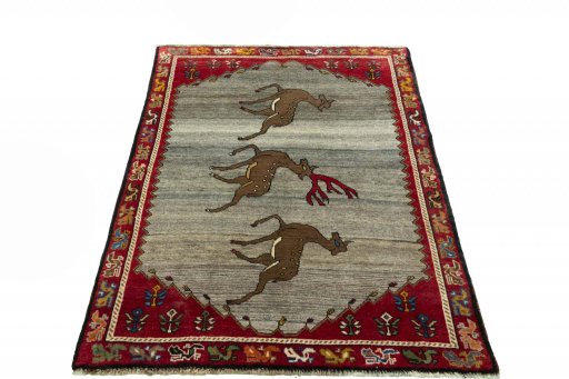 Surface texture of 2000s Persian Gabbeh rug with natural Wool and intricate pattern