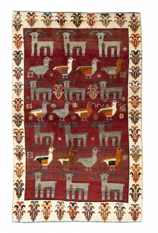 Full view of 2000s Persian Gabbeh rug from Iran / Persia, 253 × 155 cm in Red tones
