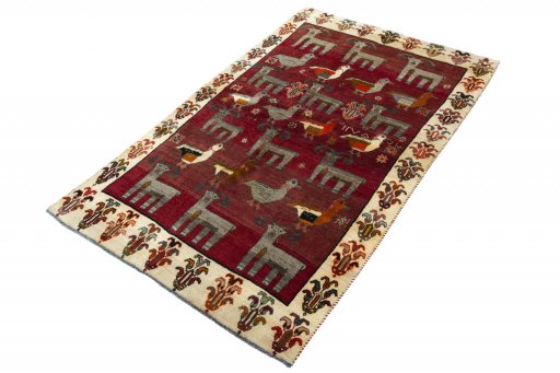 Corner detail of 2000s Persian Gabbeh rug showing border pattern and Wool pile
