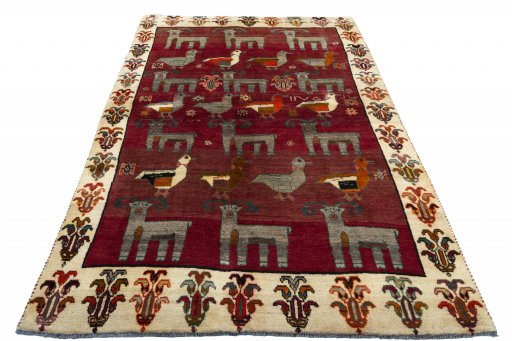 Surface texture of 2000s Persian Gabbeh rug with natural Wool and intricate pattern
