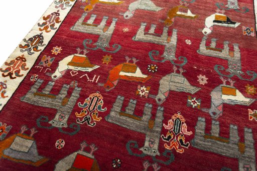 Backside of handmade 2000s Persian Gabbeh rug showing knot structure and weave density