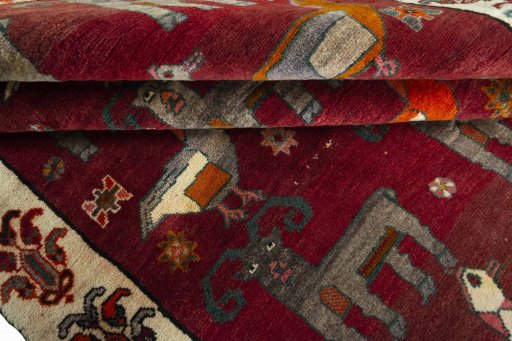 Full view of 2000s Persian Gabbeh rug from Iran / Persia, 253 × 155 cm in Red tones