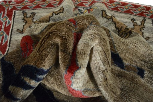 Corner detail of 2000s Persian Gabbeh rug showing border pattern and Wool pile