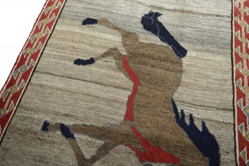 Backside of handmade 2000s Persian Gabbeh rug showing knot structure and weave density