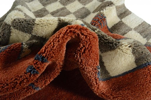 Corner detail of New Persian Gabbeh rug showing border pattern and Wool pile