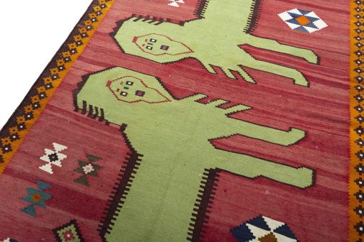 Surface texture of 2000s Persian Gabbeh rug with natural Wool and intricate pattern
