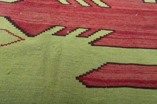 Backside of handmade 2000s Persian Gabbeh rug showing knot structure and weave density