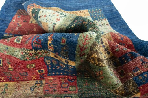 Corner detail of New Persian Gabbeh rug showing border pattern and Wool pile