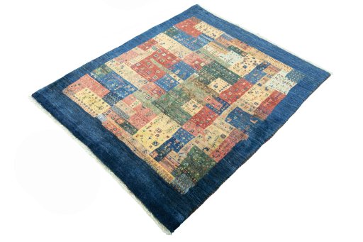 Corner detail of New Persian Gabbeh rug showing border pattern and Wool pile