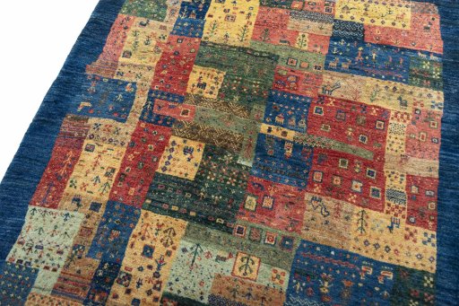 Backside of handmade New Persian Gabbeh rug showing knot structure and weave density