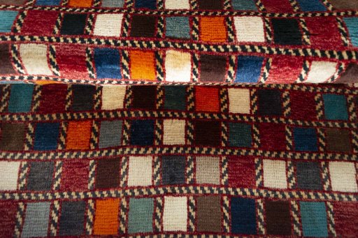 Full view of 2000s Persian Gabbeh rug from Iran / Persia, 155 × 105 cm in Multi Color tones
