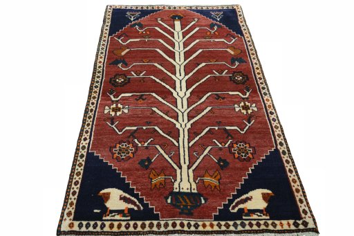 Surface texture of 2000s Persian Gabbeh rug with natural Wool and intricate pattern