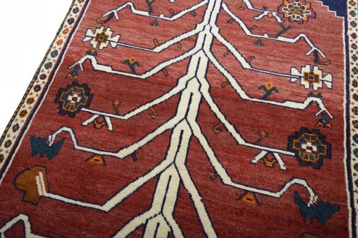Backside of handmade 2000s Persian Gabbeh rug showing knot structure and weave density