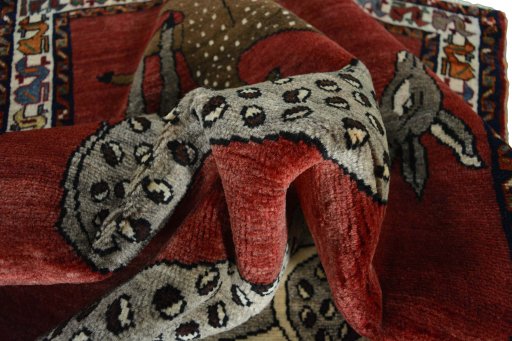 Corner detail of 2000s Persian Gabbeh rug showing border pattern and Wool pile