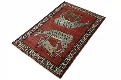 Corner detail of 2000s Persian Gabbeh rug showing border pattern and Wool pile