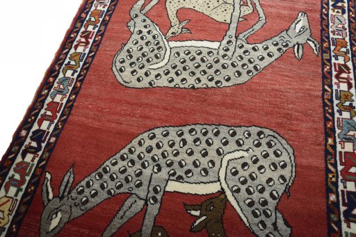 Backside of handmade 2000s Persian Gabbeh rug showing knot structure and weave density
