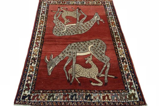 Surface texture of 2000s Persian Gabbeh rug with natural Wool and intricate pattern
