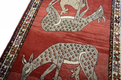 Backside of handmade 2000s Persian Gabbeh rug showing knot structure and weave density