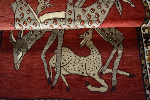 Full view of 2000s Persian Gabbeh rug from Iran / Persia, 152 × 103 cm in Red tones