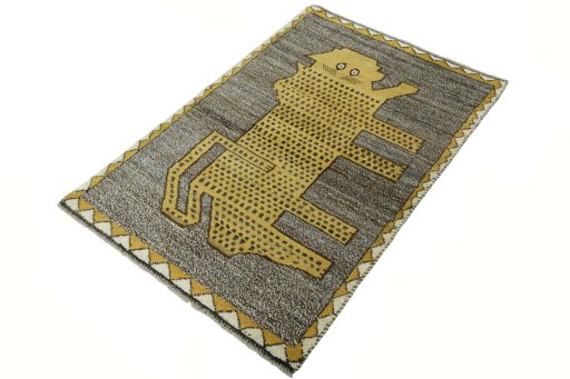 Corner detail of 2000s Persian Gabbeh rug showing border pattern and Wool pile