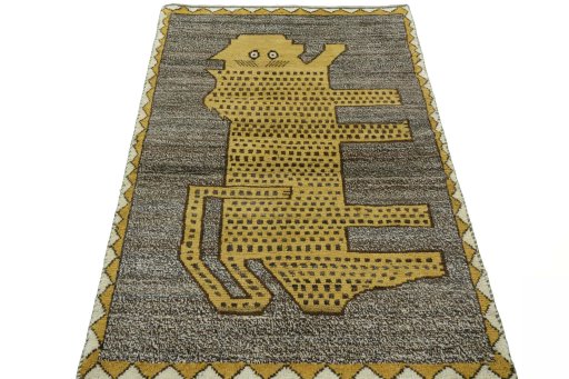 Surface texture of 2000s Persian Gabbeh rug with natural Wool and intricate pattern