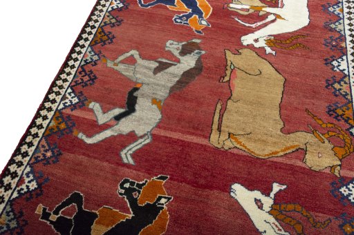Backside of handmade 2000s Persian Gabbeh rug showing knot structure and weave density
