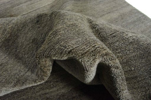 Corner detail of New Persian Gabbeh rug showing border pattern and Wool pile