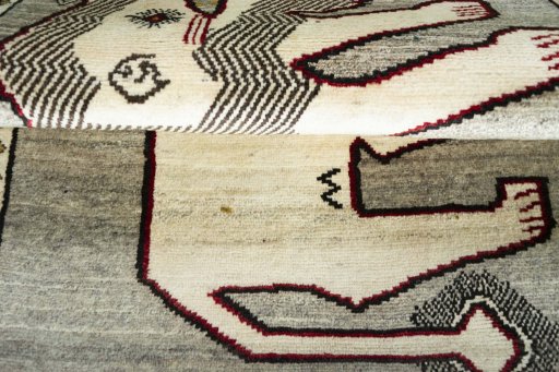 Corner detail of 2000s Persian Gabbeh rug showing border pattern and Wool pile