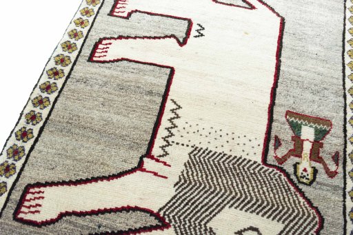 Backside of handmade 2000s Persian Gabbeh rug showing knot structure and weave density