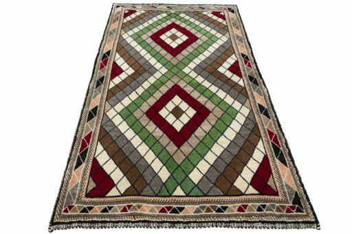 Surface texture of 2000s Persian Gabbeh rug with natural Wool and intricate pattern