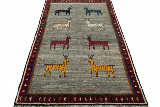Surface texture of 2000s Persian Gabbeh rug with natural Wool and intricate pattern