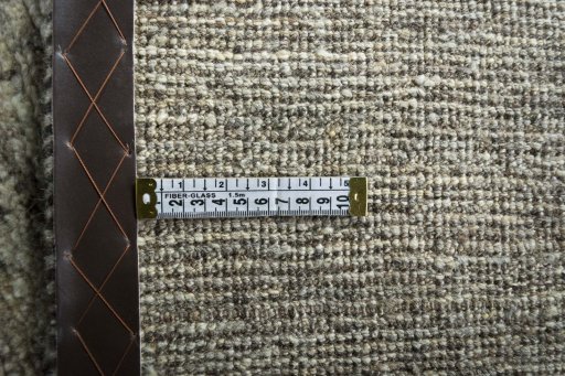 Corner detail of 2000s Persian Gabbeh rug showing border pattern and Wool pile
