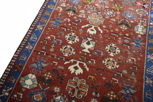 Backside of handmade 2000s Persian Gabbeh rug showing knot structure and weave density