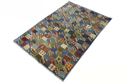 Corner detail of 2000s Persian Gabbeh rug showing border pattern and Wool pile