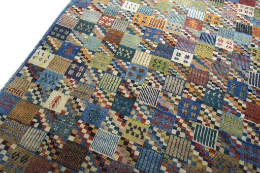 Backside of handmade 2000s Persian Gabbeh rug showing knot structure and weave density