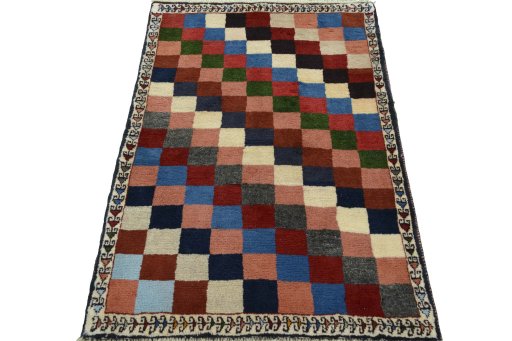 Surface texture of 2000s Persian Gabbeh rug with natural Wool and intricate pattern