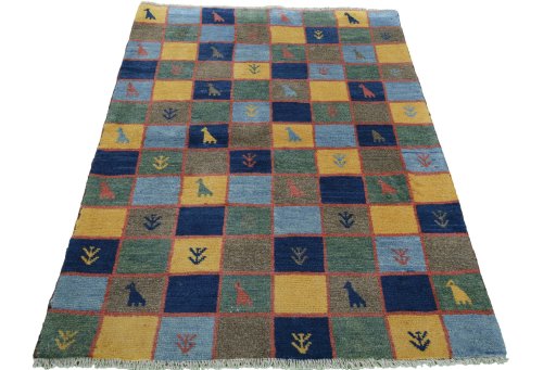 Surface texture of 2000s Persian Gabbeh rug with natural Wool and intricate pattern
