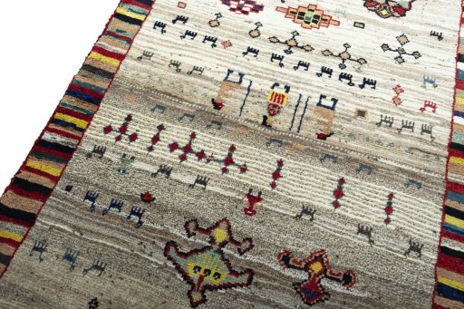 Backside of handmade 2000s Persian Gabbeh rug showing knot structure and weave density