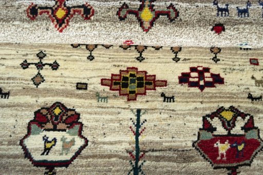 Full view of 2000s Persian Gabbeh rug from Iran / Persia, 136 × 107 cm in Beige tones